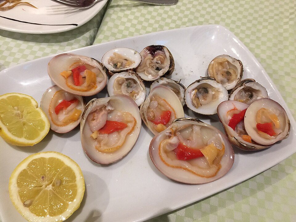 best restaurants in malaga - traditional tapas bar with wine barrels and local food
