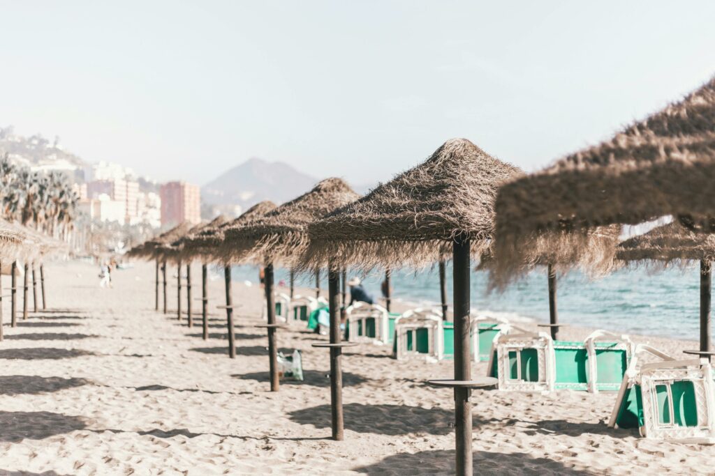 Huelin and Misericordia Beach best beaches in malaga - Playa de la Malagueta with palm trees and blue sea